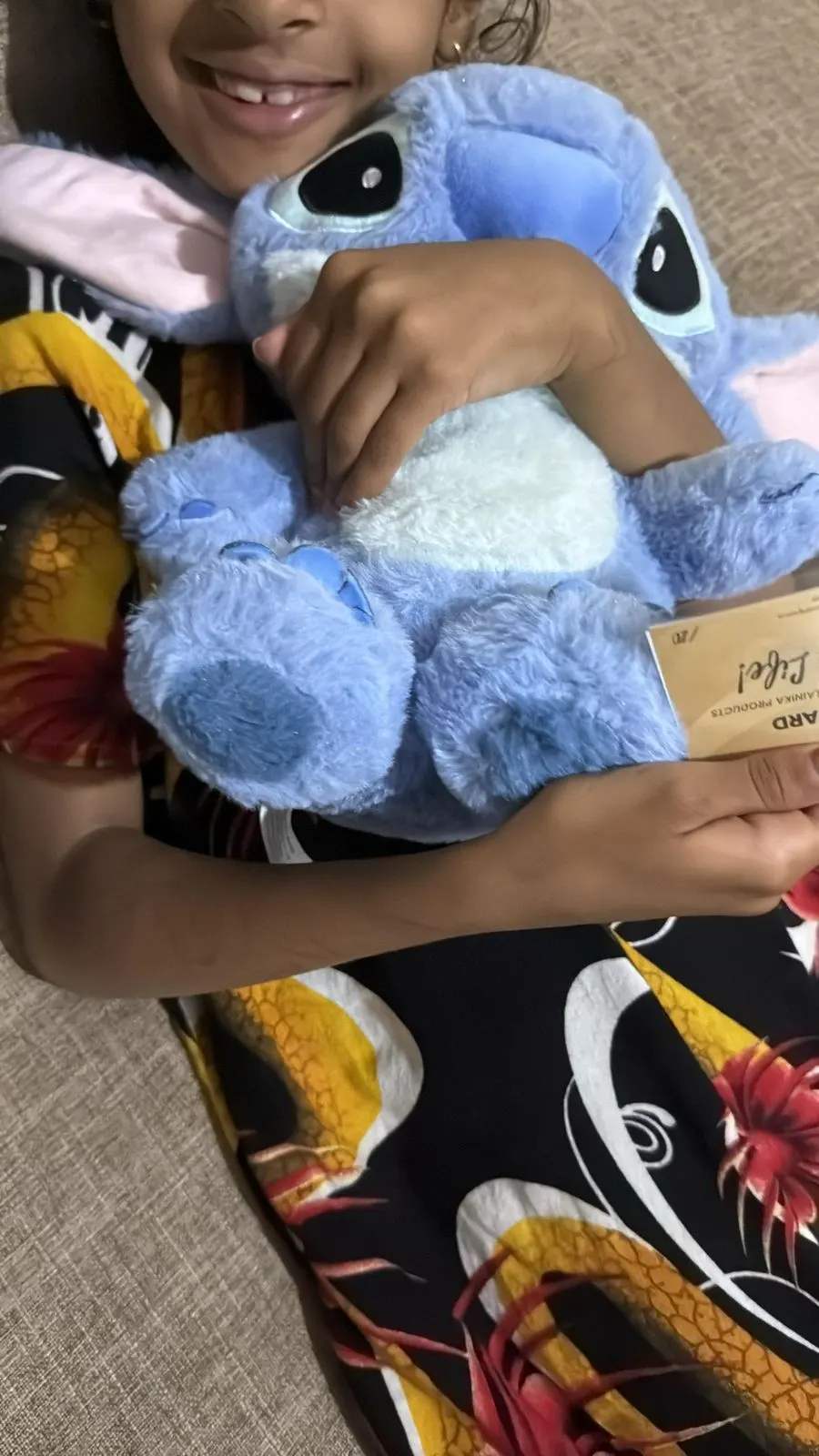 A young girl with her Stitch plushie